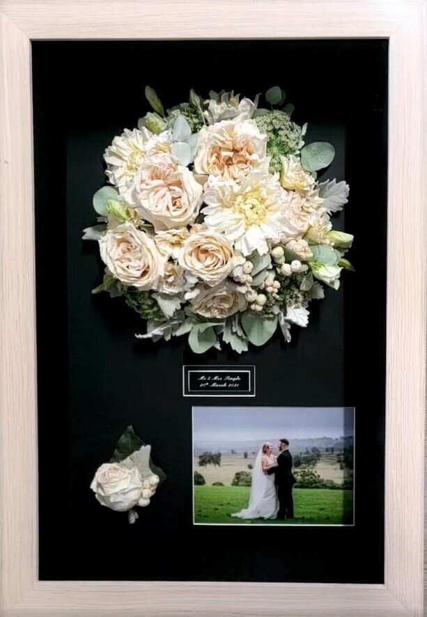 Wedding bouquet preserved in 3D frame.