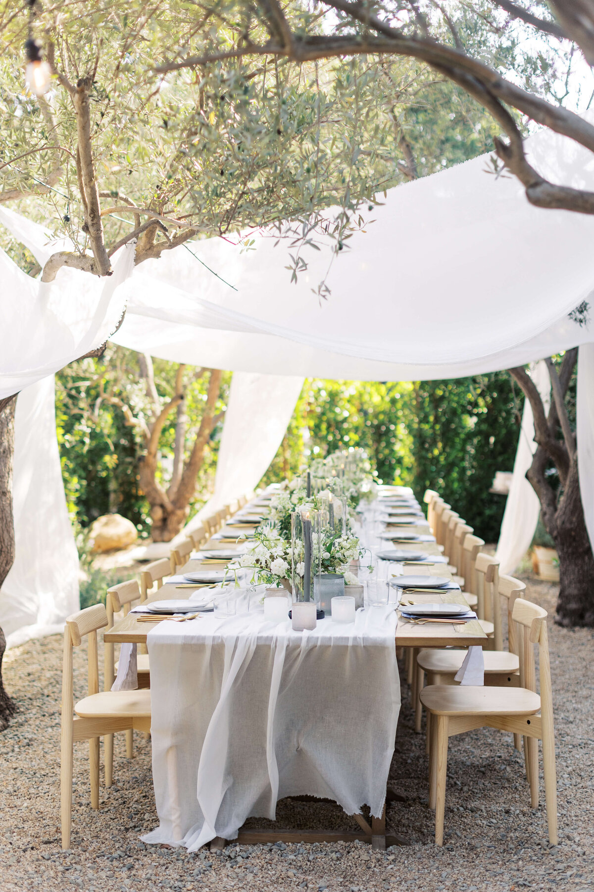Intimate reception table draped with linens.