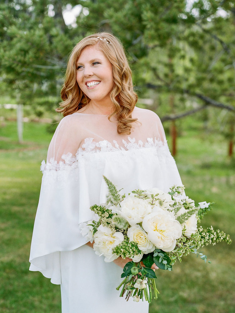 Bridal portrait with bouquet at a horse ranch wedding venue in Colorado