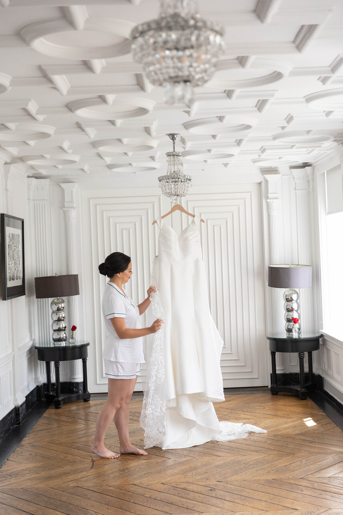 Bride looking at the wedding dress