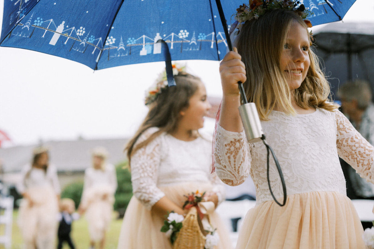 flower-girl-holding-umbrella
