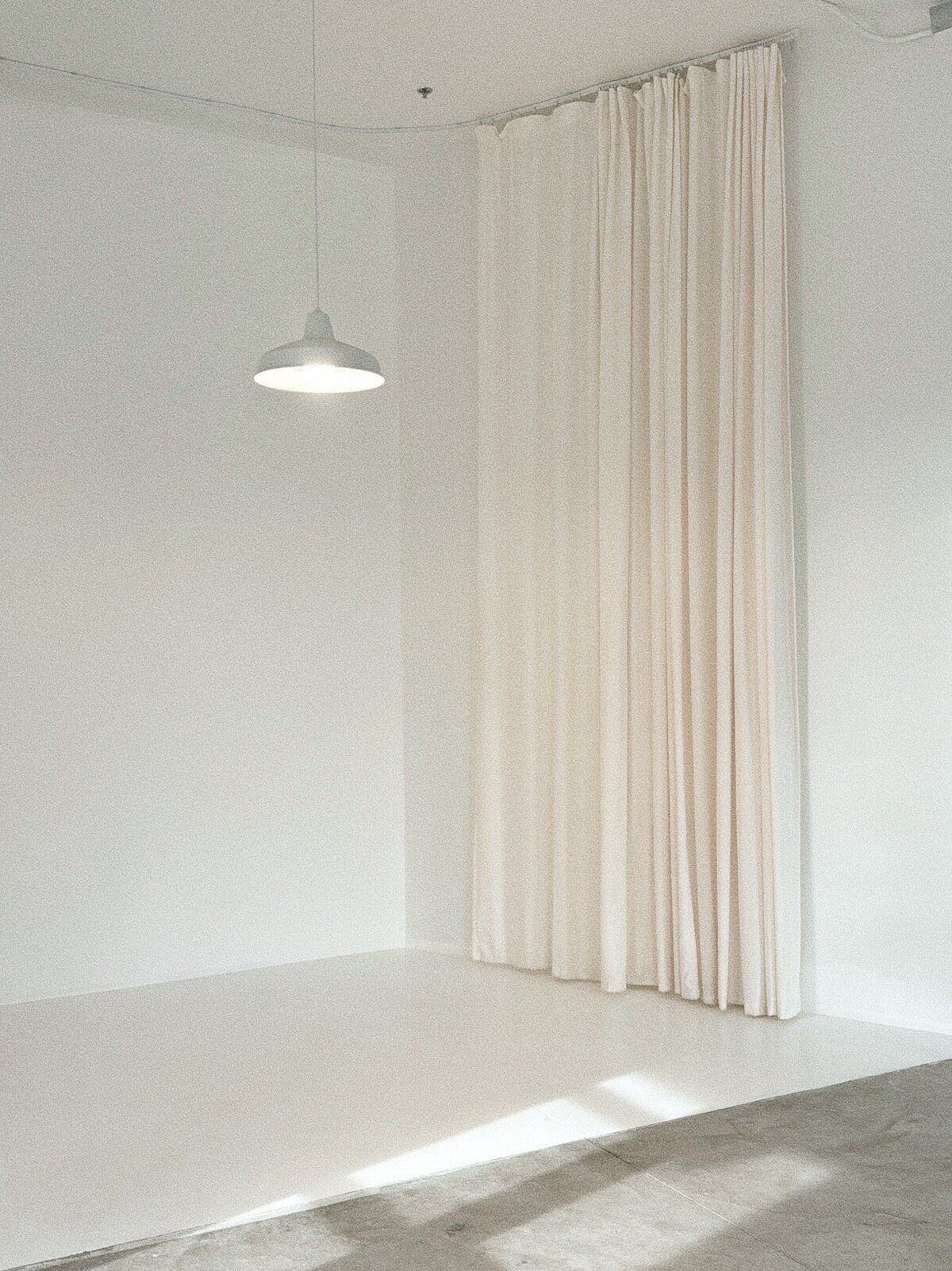 Photo wall with white curtains Light House Studio Albuquerque