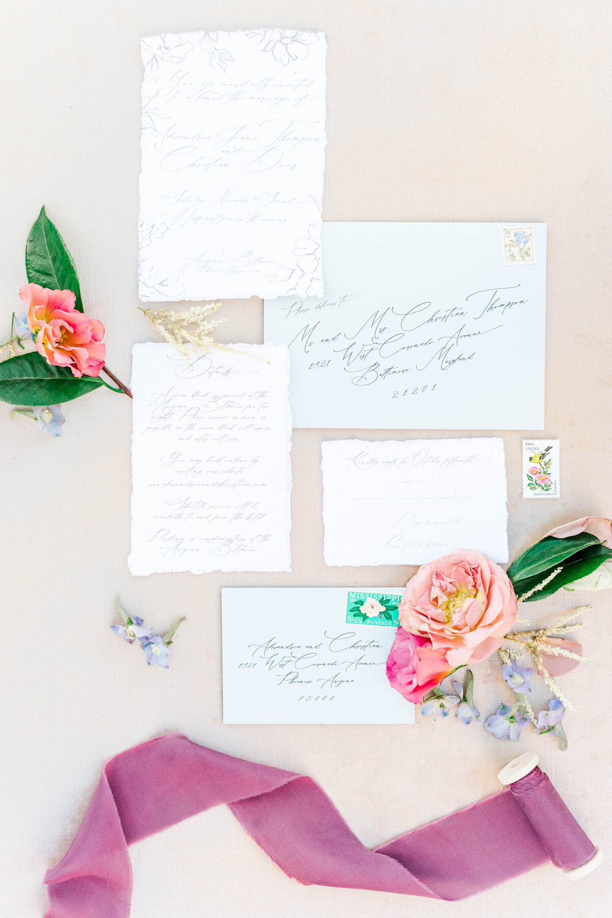 Wedding invitation suite with roses and pink ribbon
