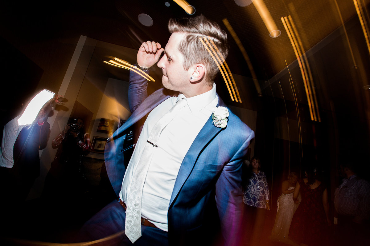Lake Tahoe wedding photos groom dancing during reception