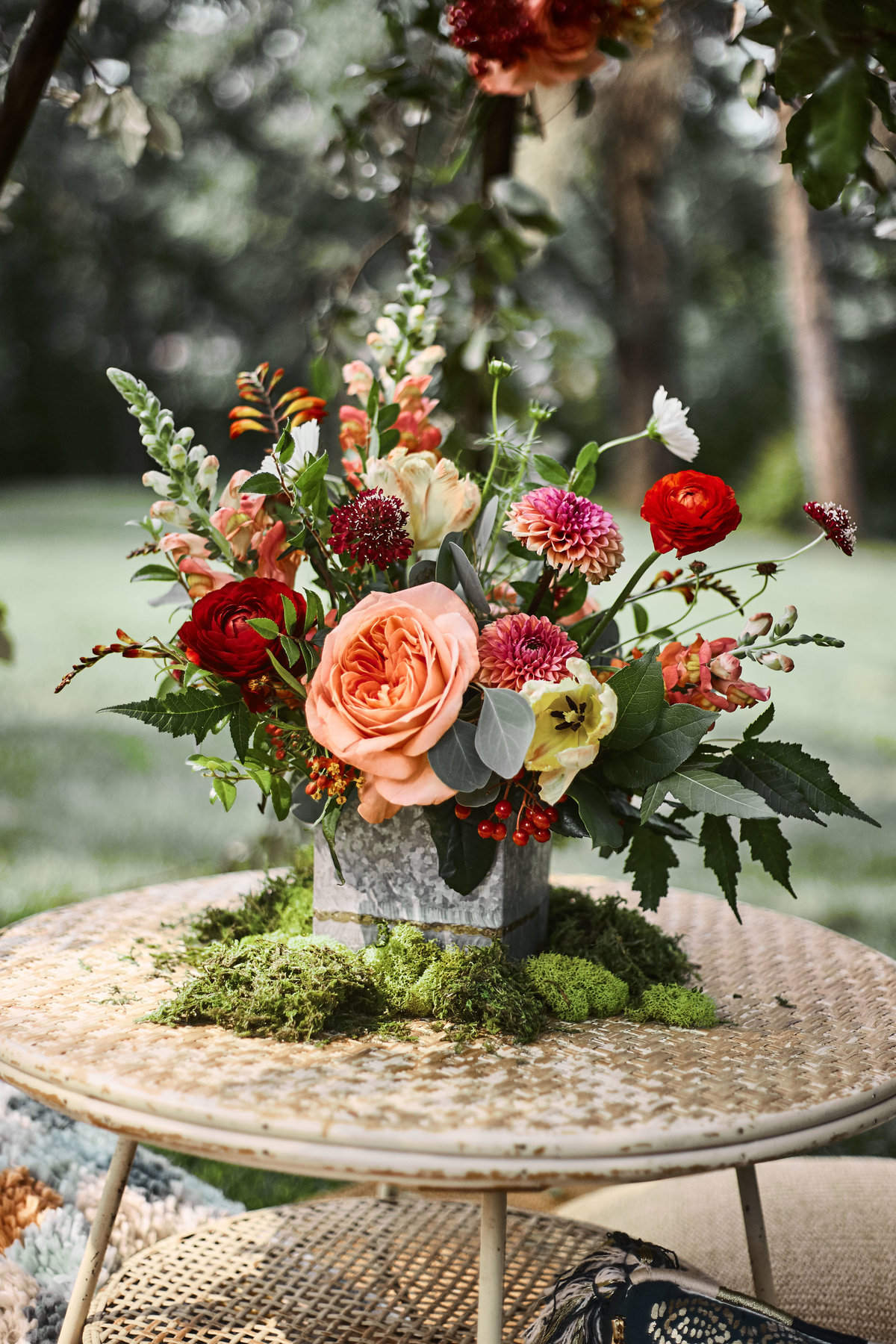 moss, galvanized planter, flowers