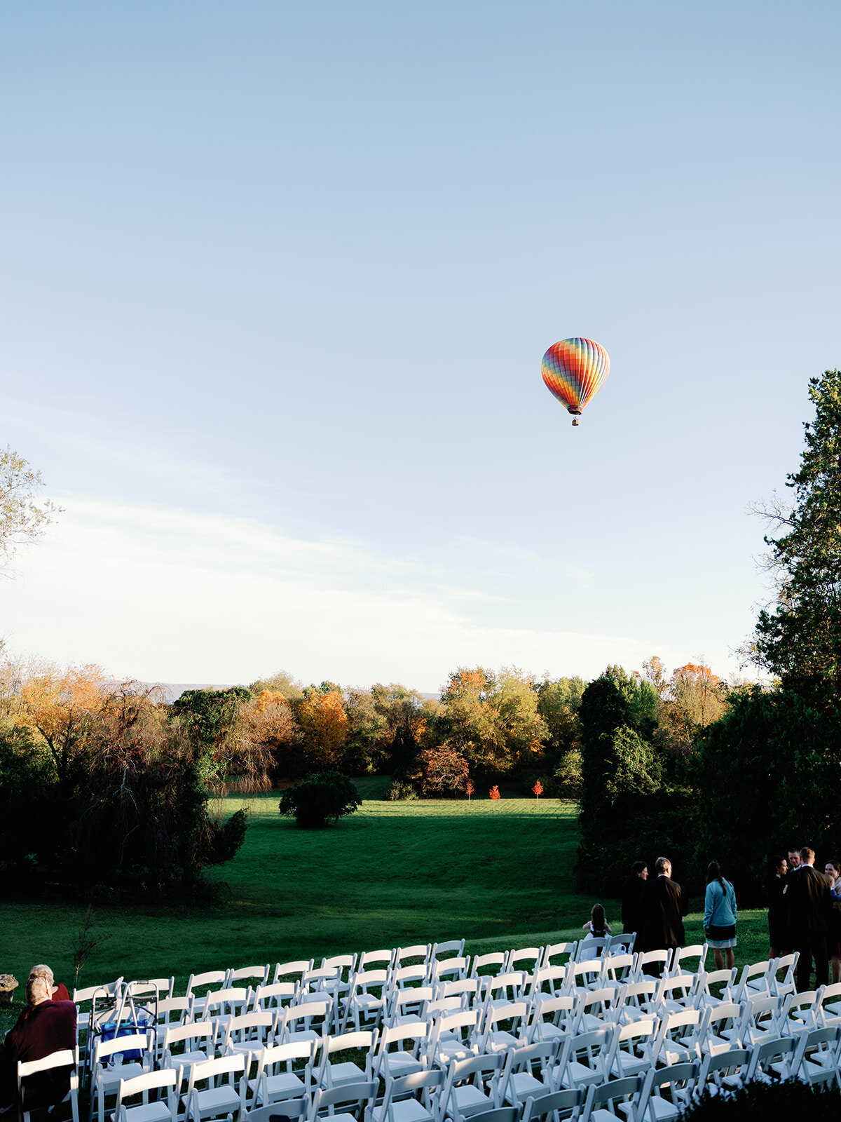 a hot air baloon floats through the sky at rosemont manor