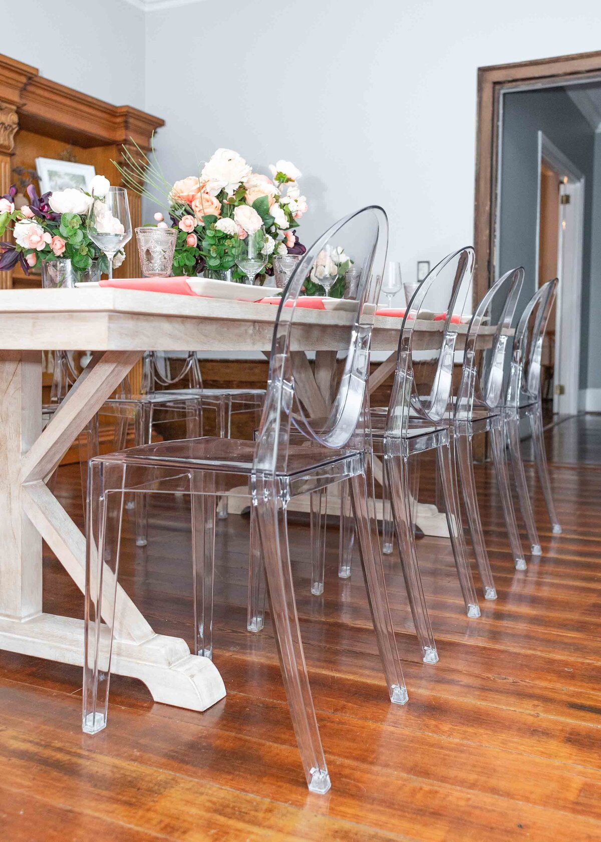 Close-up of the best wedding rentals in Raleigh NC for indoor events, featuring elegant chairs and a beautifully set table. Perfect for showcasing high-quality rentals and attention to detail.