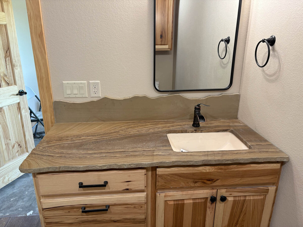 wood-looking-granite-countertops-in-bathroom-rough-edge