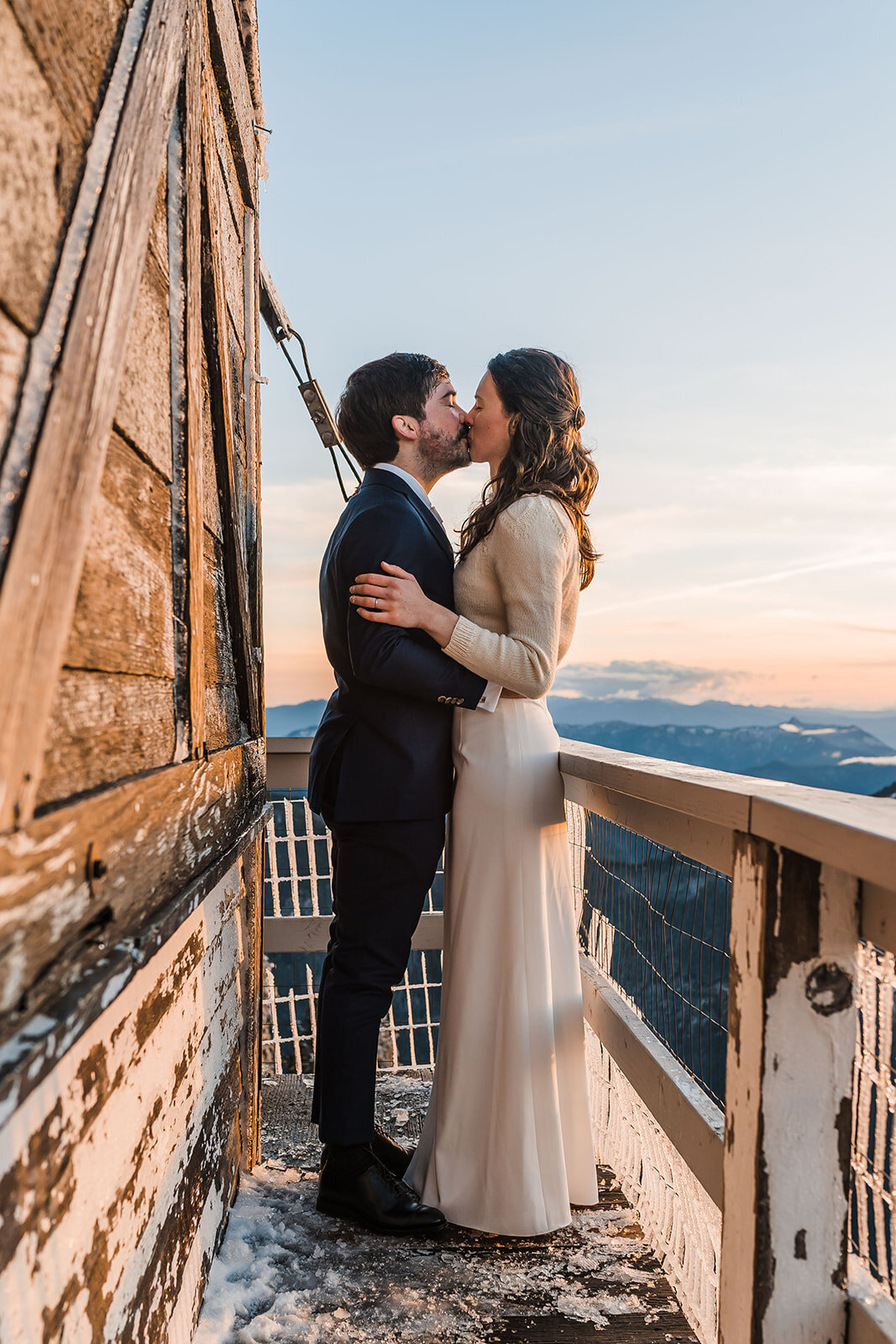 Bride & groom kissing on the deck of Fremont Fire Lookout in Mount Rainier National Park!