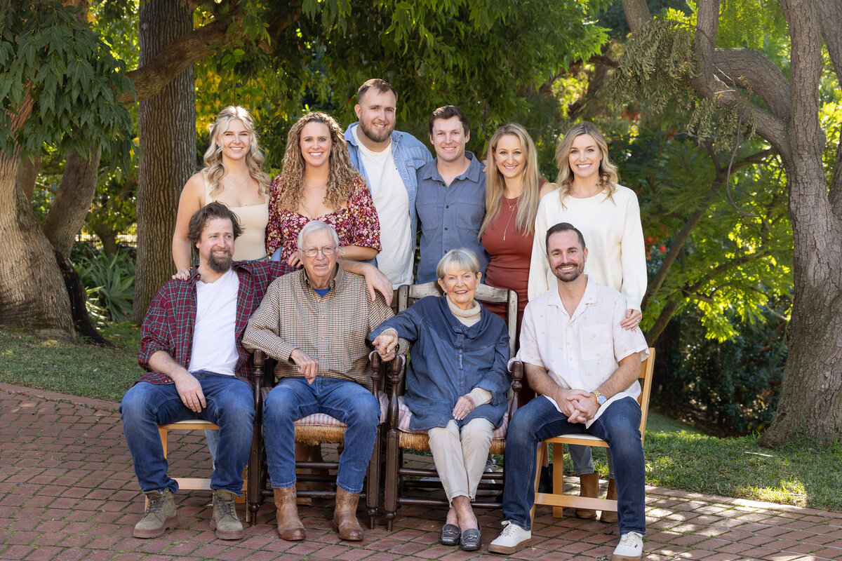 grand-parents with grand-kids sitting on a bench