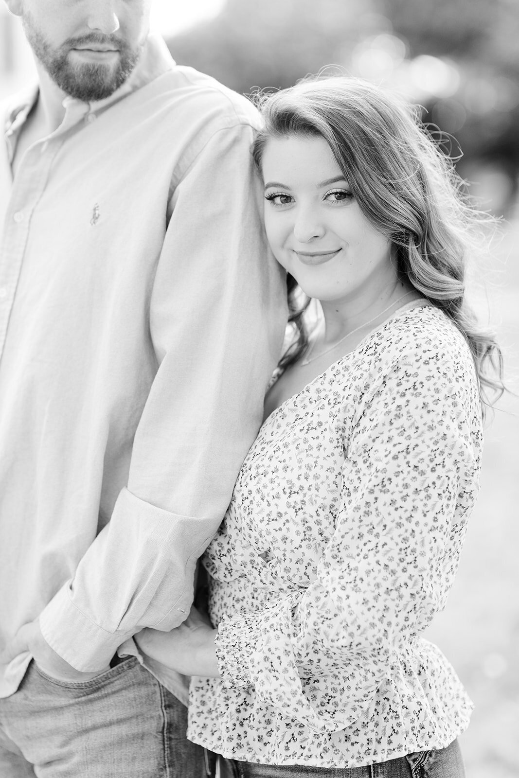 Engagement photo of couple embracing in black and white