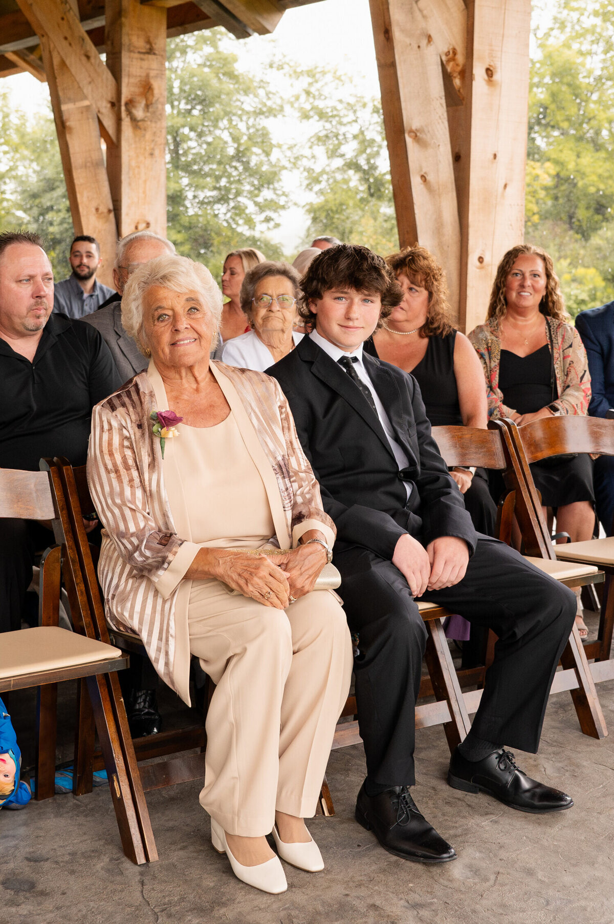 A candid photo of guests attending a wedding at The Barn at Lord Howe in Ticonderoga, NY.