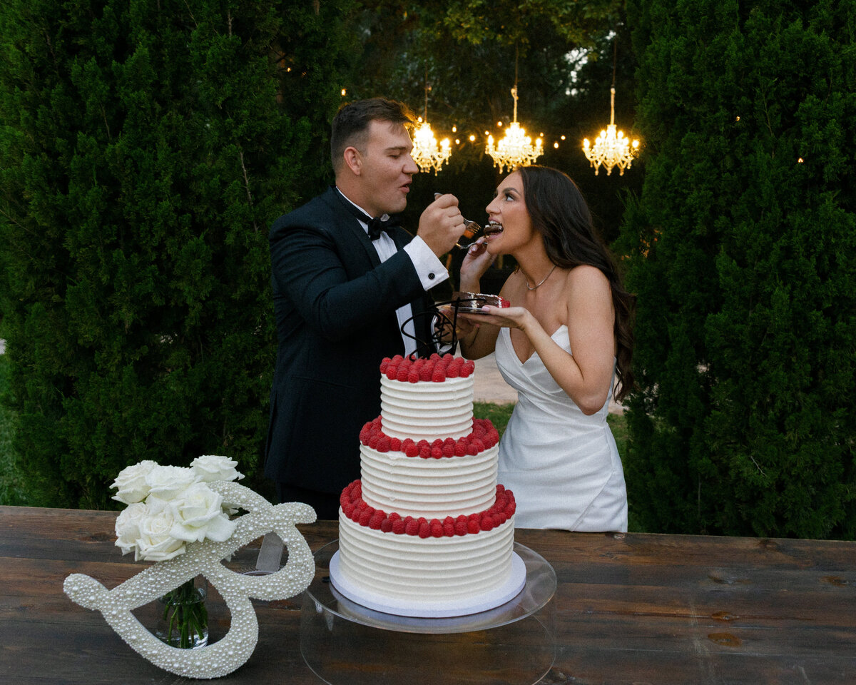 groom feeding bride cake at La Casa Toscana Wedding Venue Fort Myers Florida