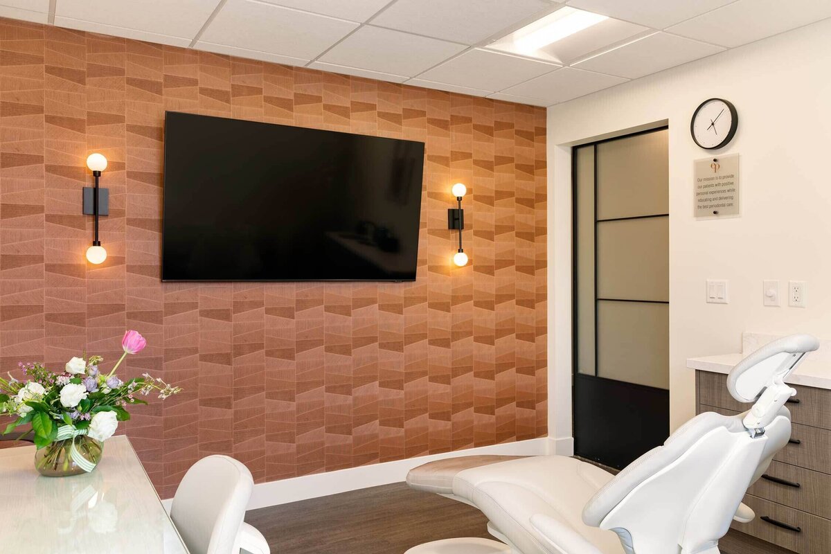 Detail shot of colorful wallpaper and custom sliding barn doors in Utah dental office