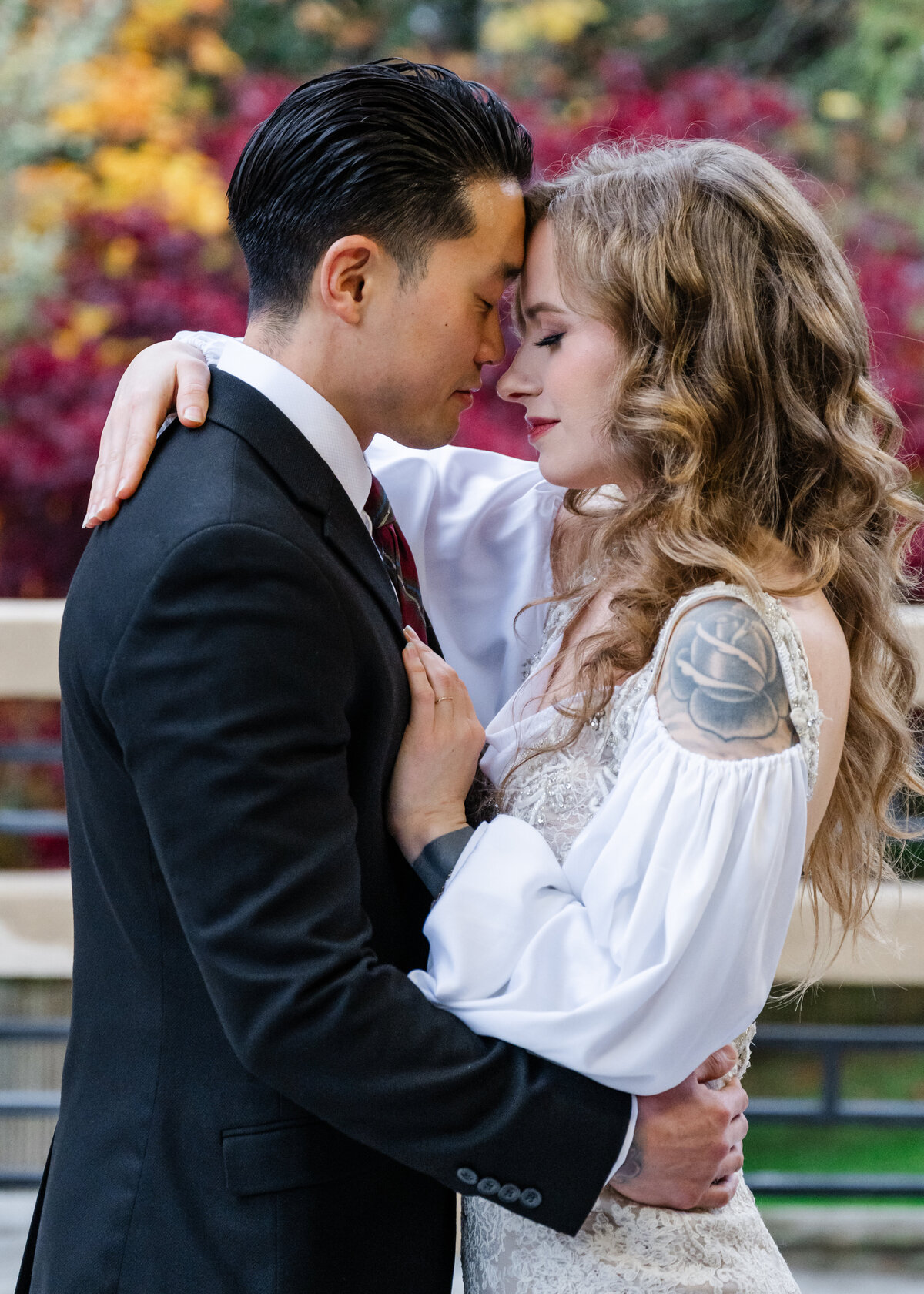 fall wedding couple at point defiance pagoda on deck