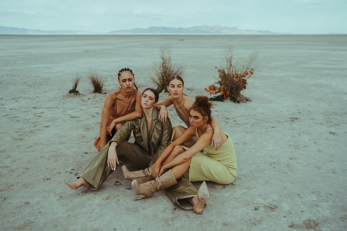 women sitting in the desert