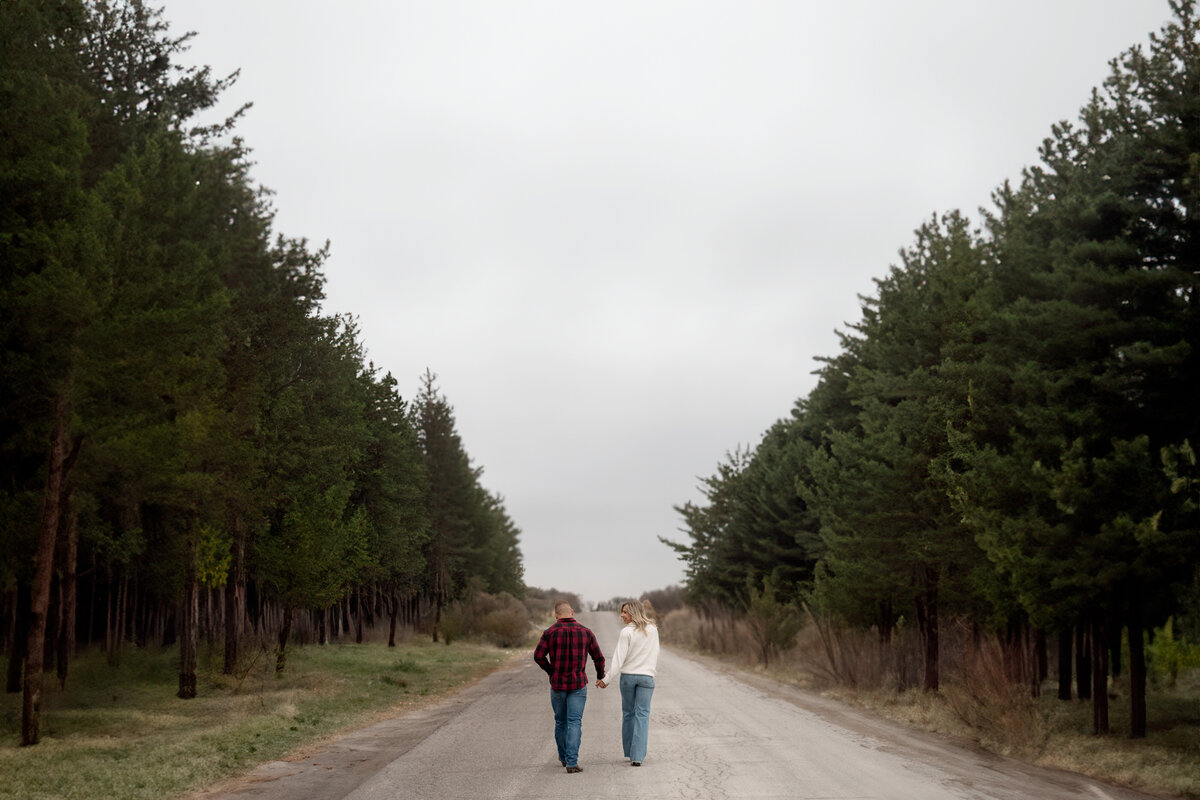 Couple walking  and holding hands during their lifestyle photography in Ottawa