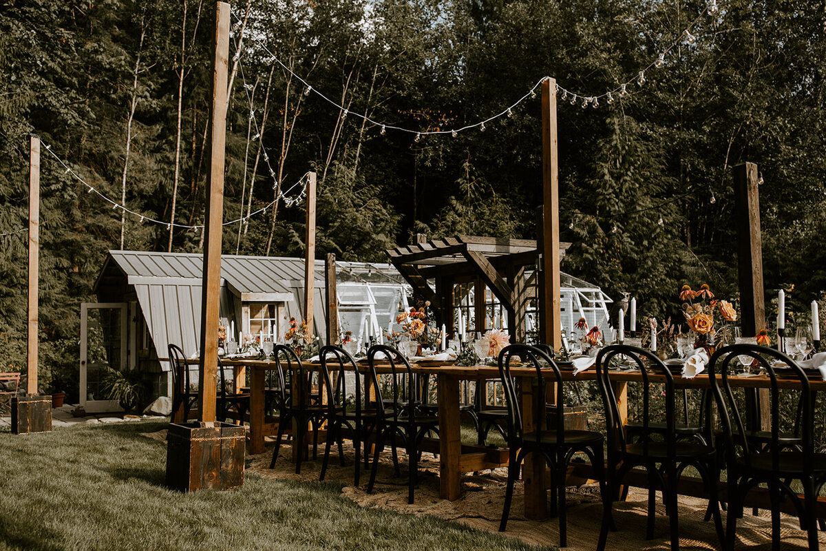 Beautiful rustic outdoor wedding reception at The Greenhouse, a unique garden wedding venue in Abbotsford, BC, featured on the Brontë Bride Vendor Guide.