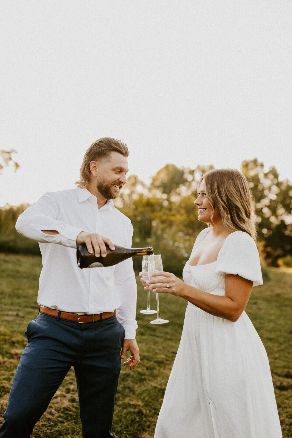 champagne toast engagement pictures