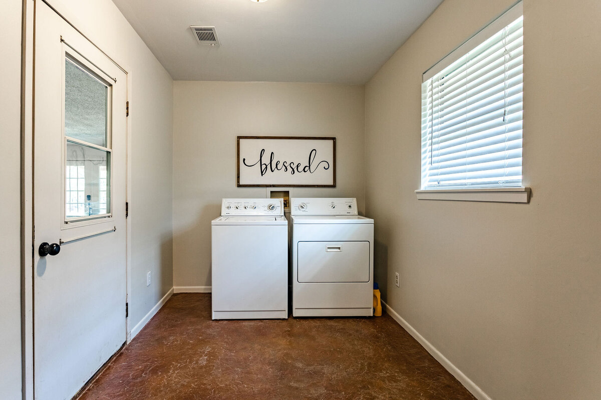Laundry area with washer and dryer in this three-bedroom, two-bathroom ranch house for 7 with incredible hiking, wildlife and views.