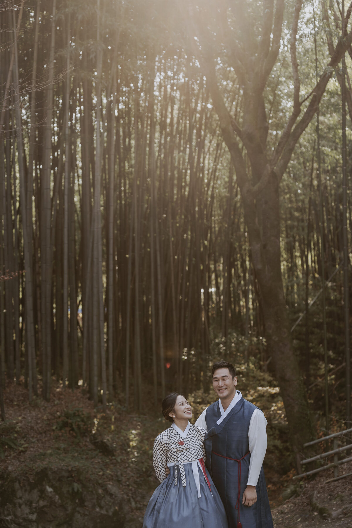 the bride looking at the groom while smiling in soswaewon garden in damyang south korea