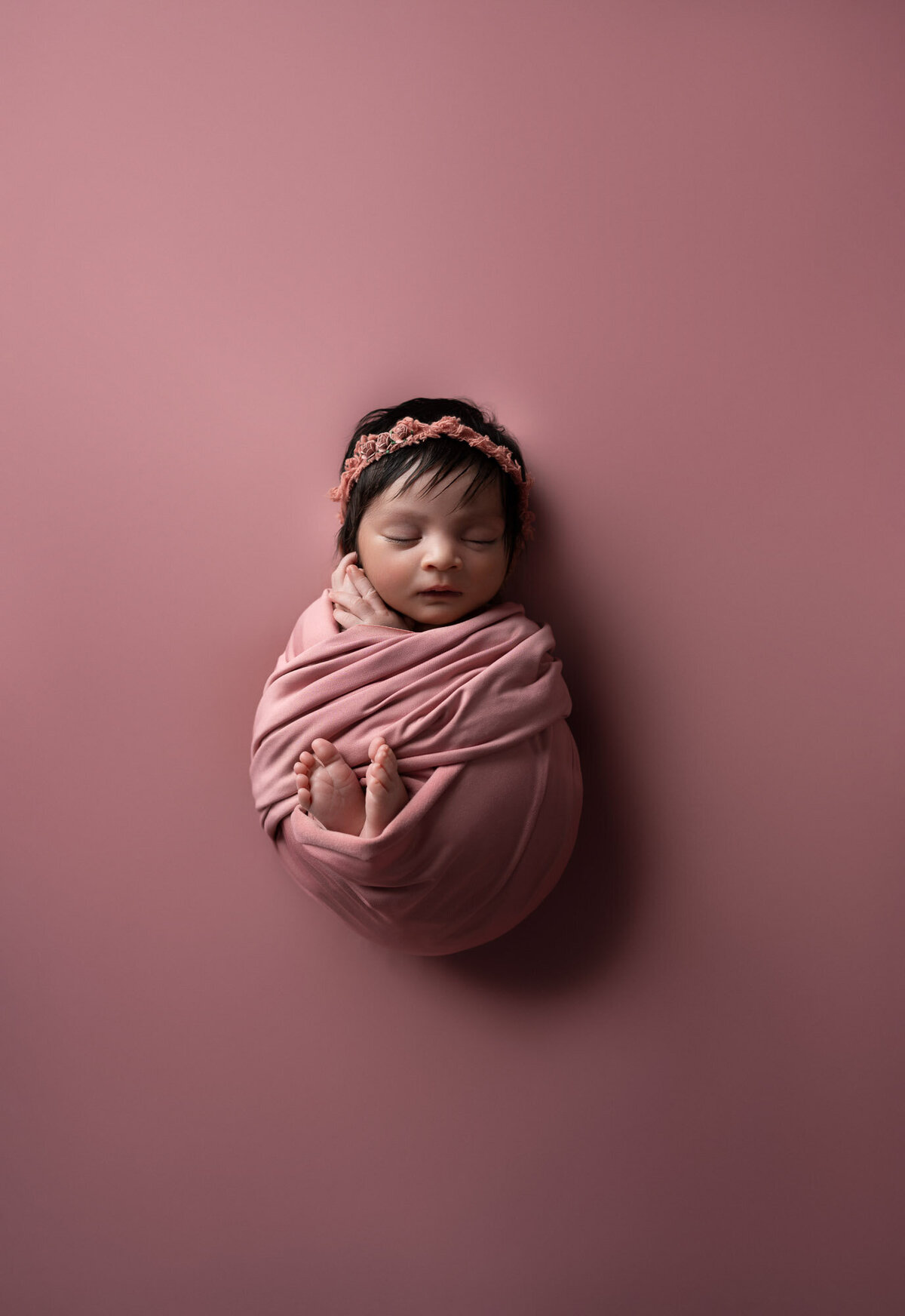 Newborn baby girl pink wrap floral headband Lakeway professional photographer