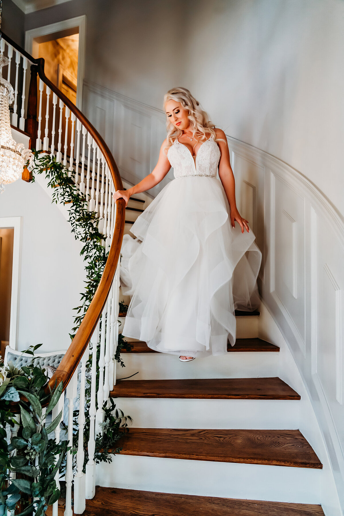 a bride walking down her venue stairs