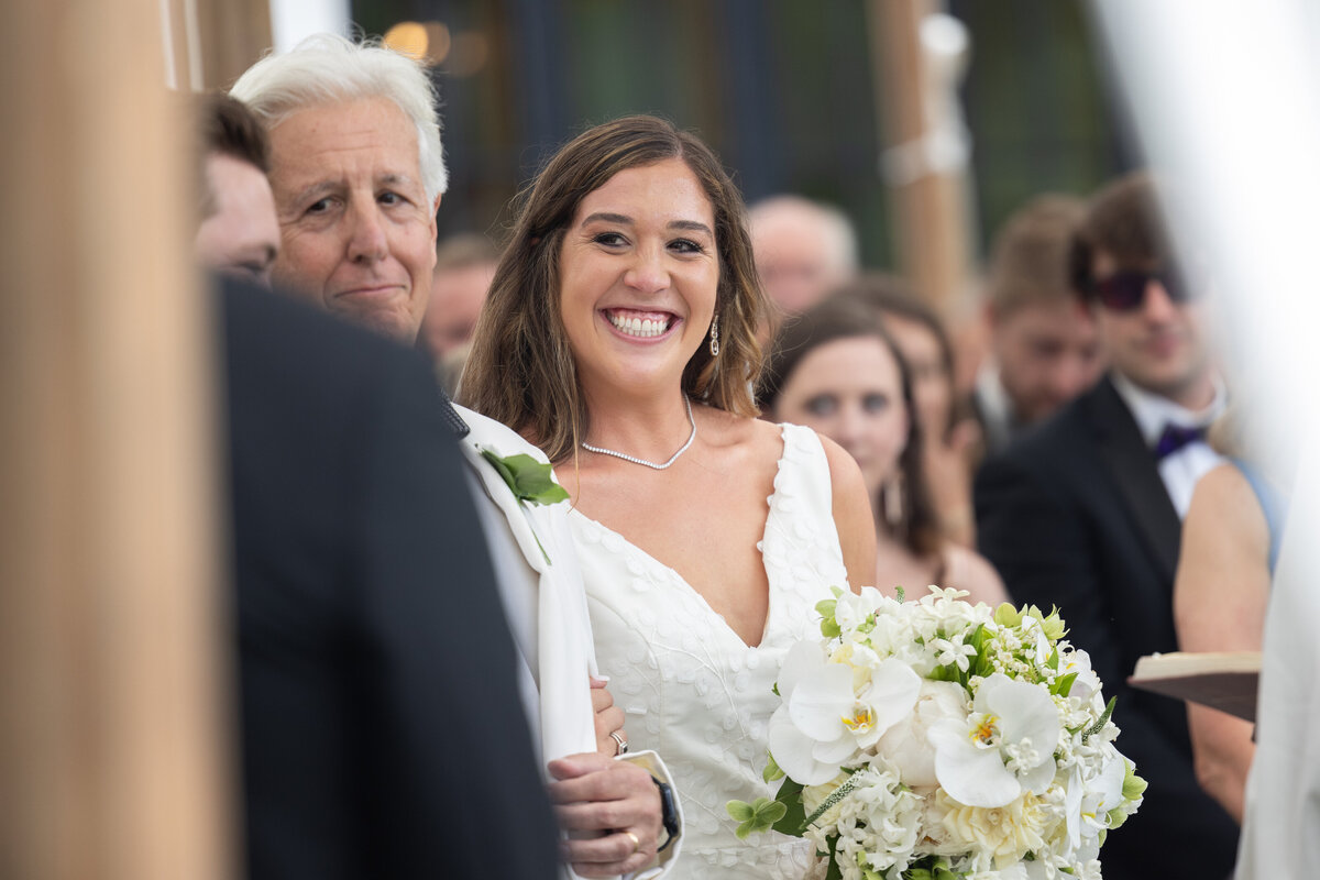 Bride Smiles at Groom during Wedding Ceremony