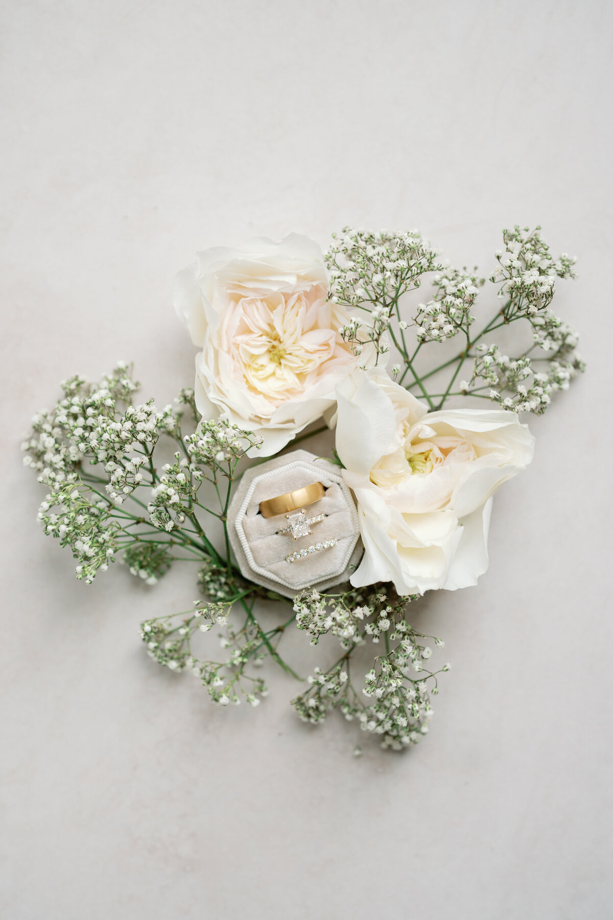 Timeless bridal flatlay with babies breath and white roses