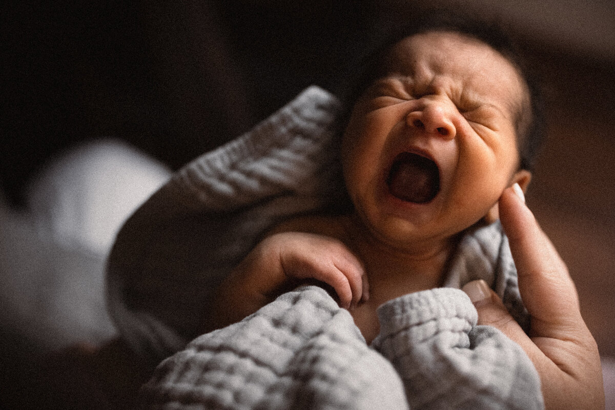 newborn baby yawning