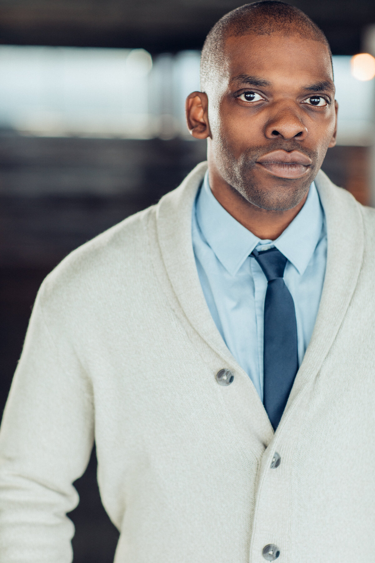 Man Wearing White Coat with Inner Light Blue Long Sleeve and Blue Necktie Headshot in LA