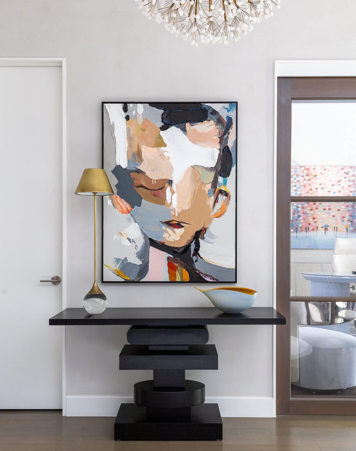 rebekah nicole interiors arbor abstract painting of a face and gold lamp