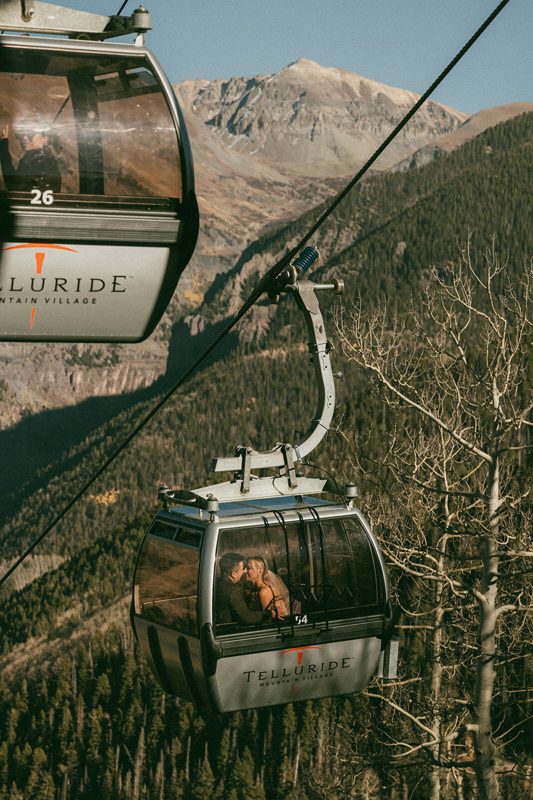 couple kissing in Telluride ski gondola