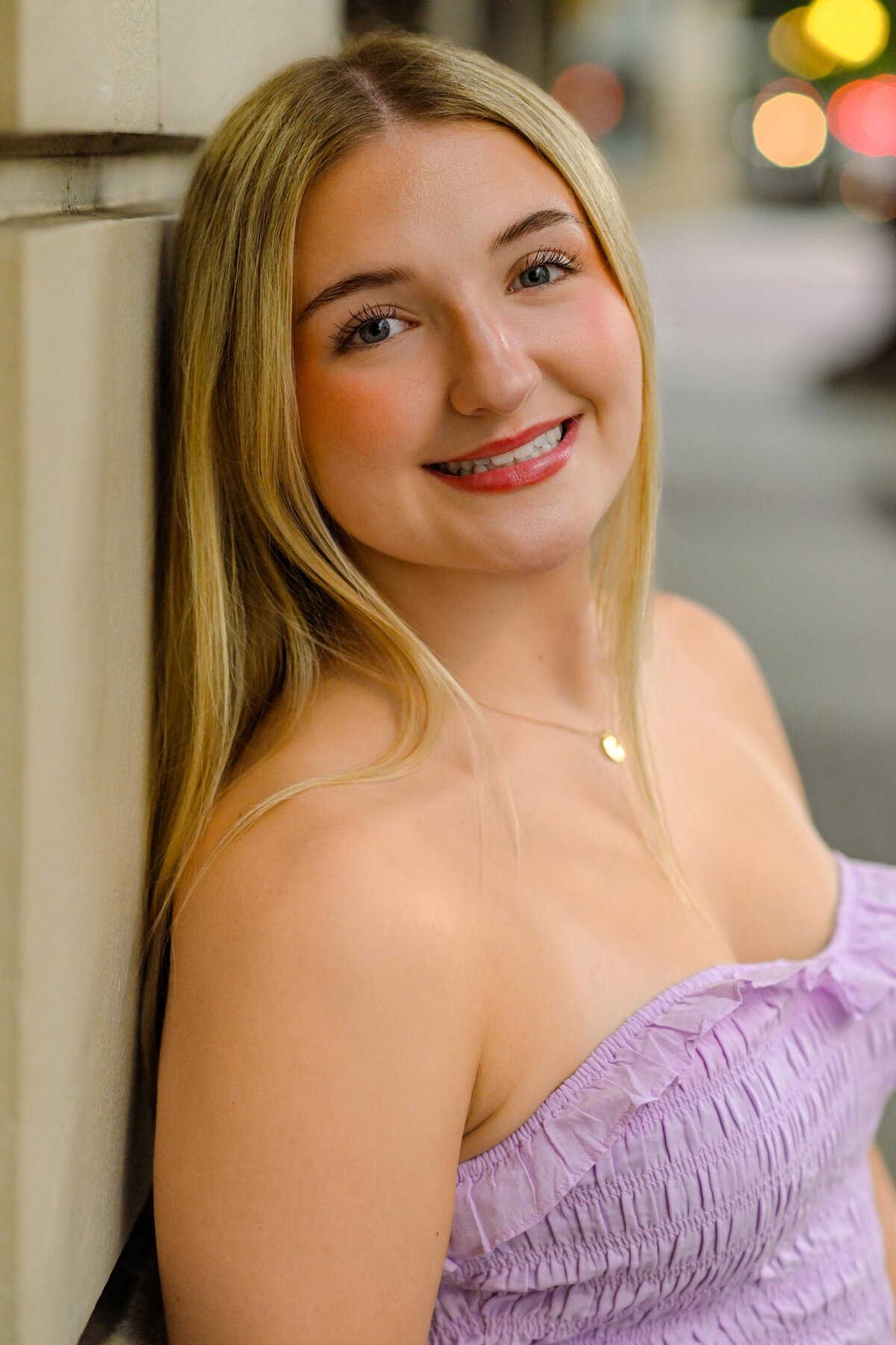 Senior Girl Leaning Against Wall