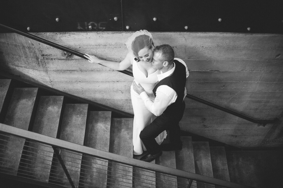 bride and groom in romantic pose on leftbank annex staircase