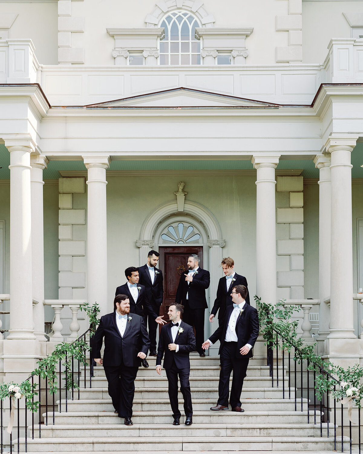 Groom party on the steps of great marsh estate