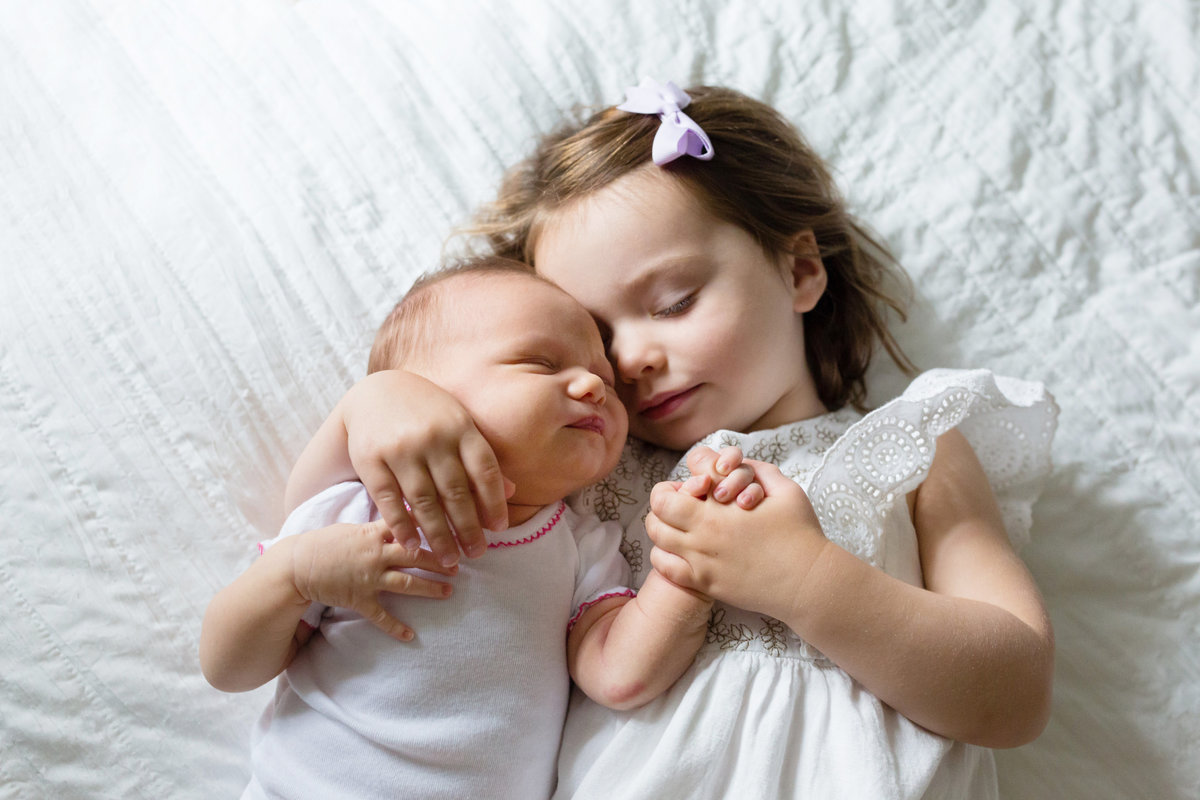 Toddler hugging newborn baby - Jen Madigan - Plainfield IL Newborn Photography