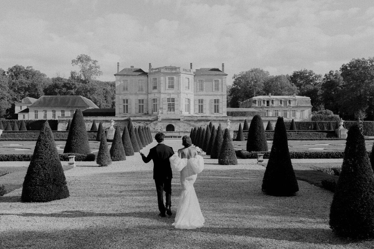 bride and groom walking scottish castle