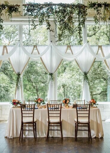 Bliss_CathedralOaks white voille-draping-greenery-rec table