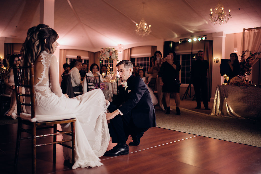 Wedding Photograph Of Groom Kneeling In Front Of Bride Los Angeles