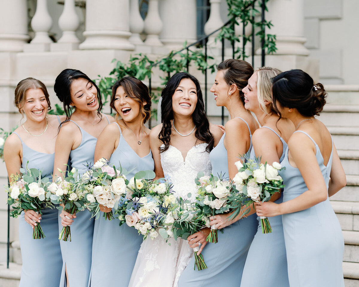 Bridal Party sharing happiness wearing light blue dresses