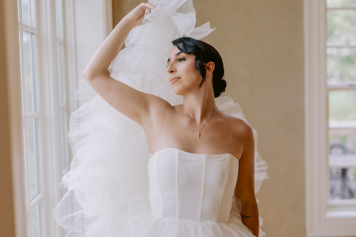 Wedding Photographer, a bride holding her dress above her head -1243