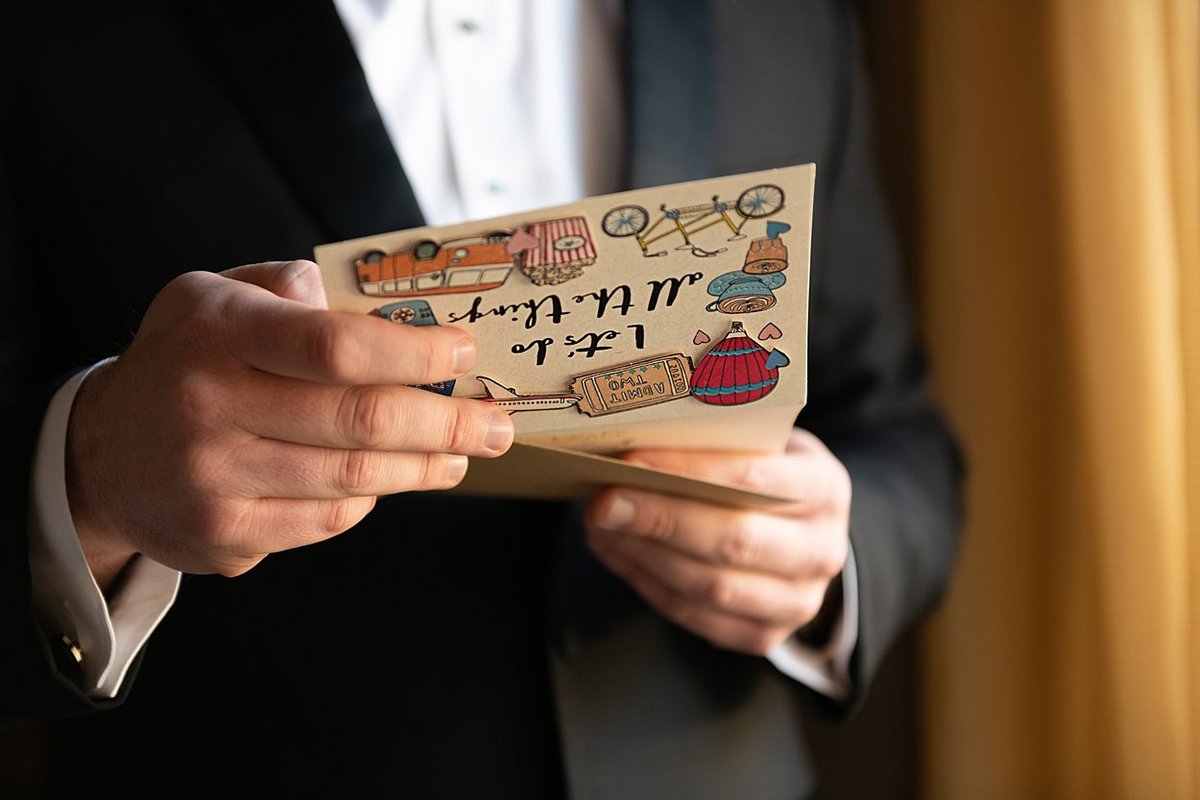 Groom reading card from Bride