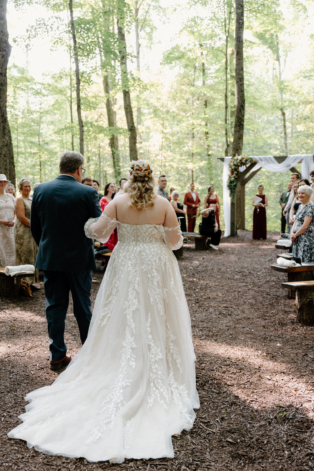 Bride with her father, walking down the aisle towards the groom