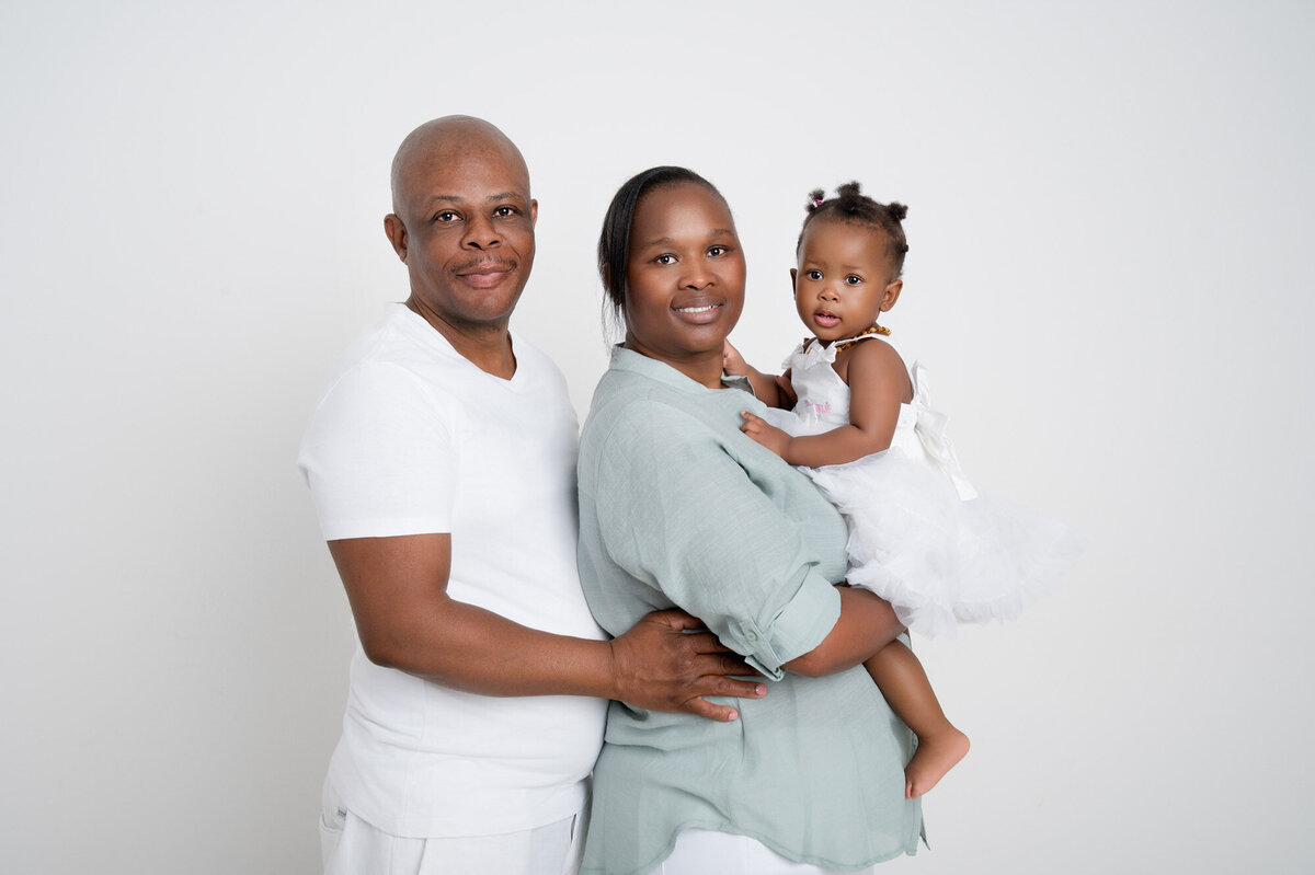 parents with first birthday baby girl