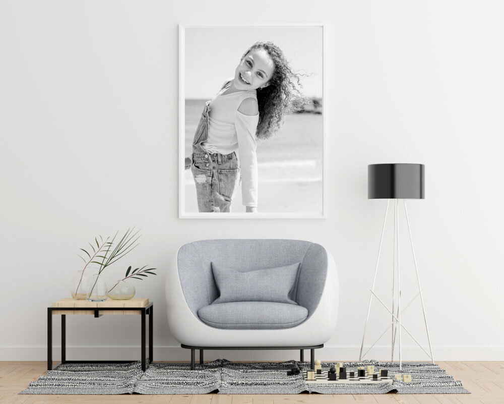 Photo of young girl framed on wall