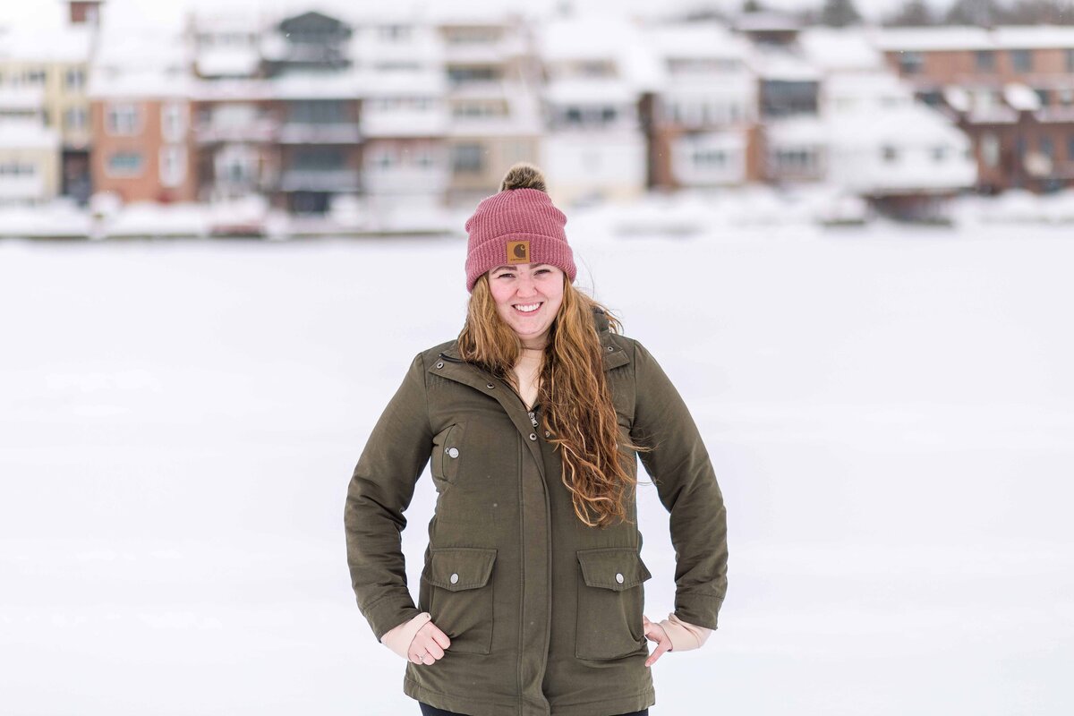 Woman on frozen lake in the winter in Skaneateles NY