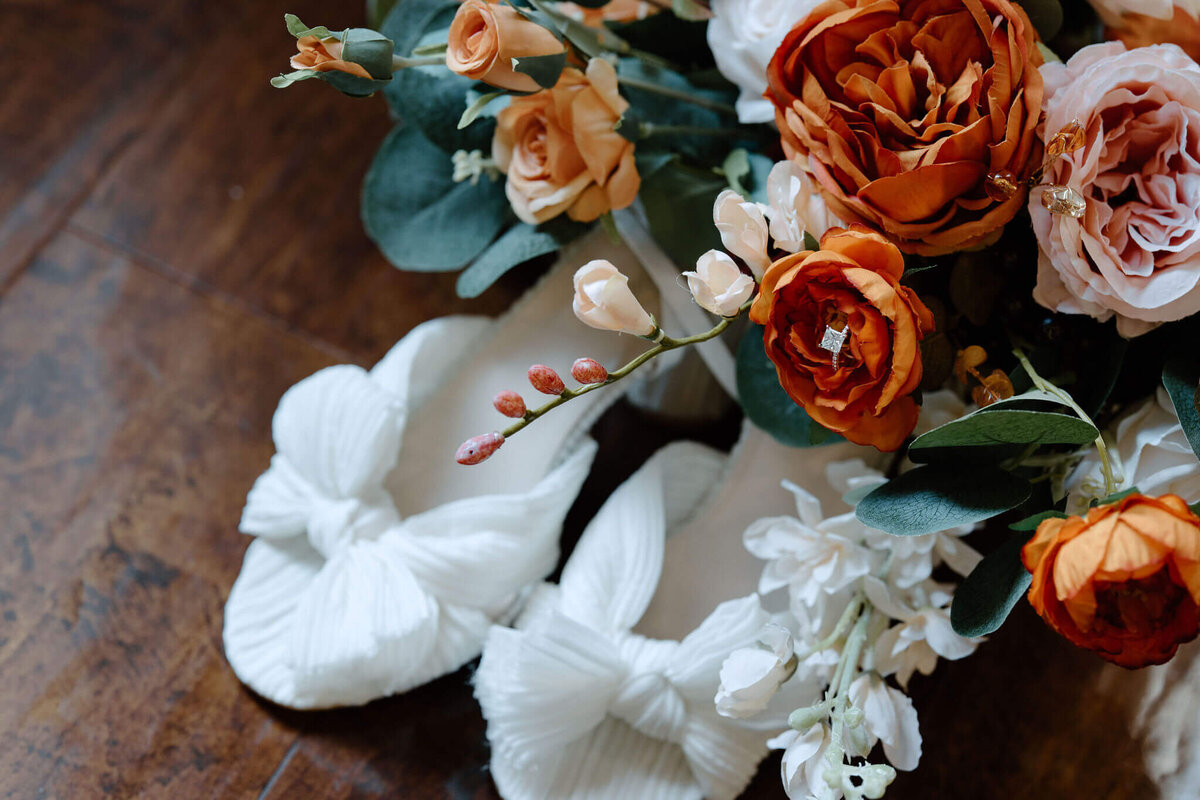 fall wedding bouquet, white heels, and wedding band detail portrait a