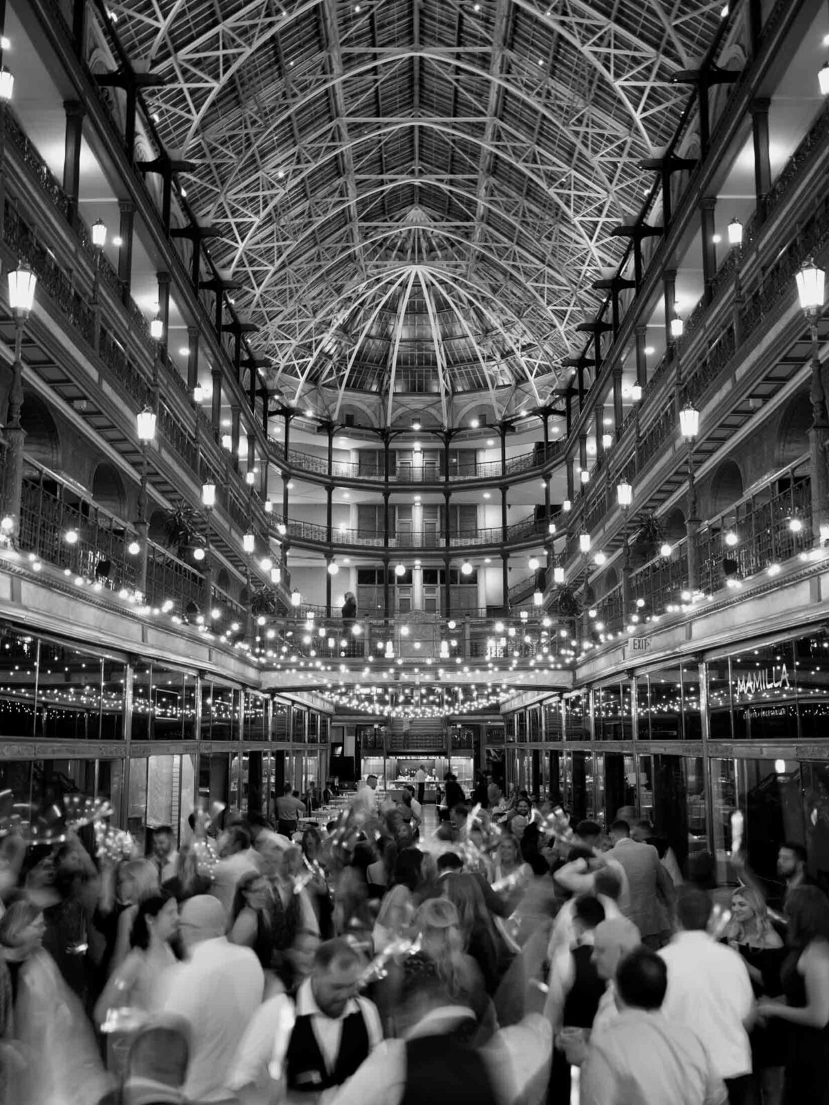 Overhead view of reception at The Arcade with string lights and modern decor