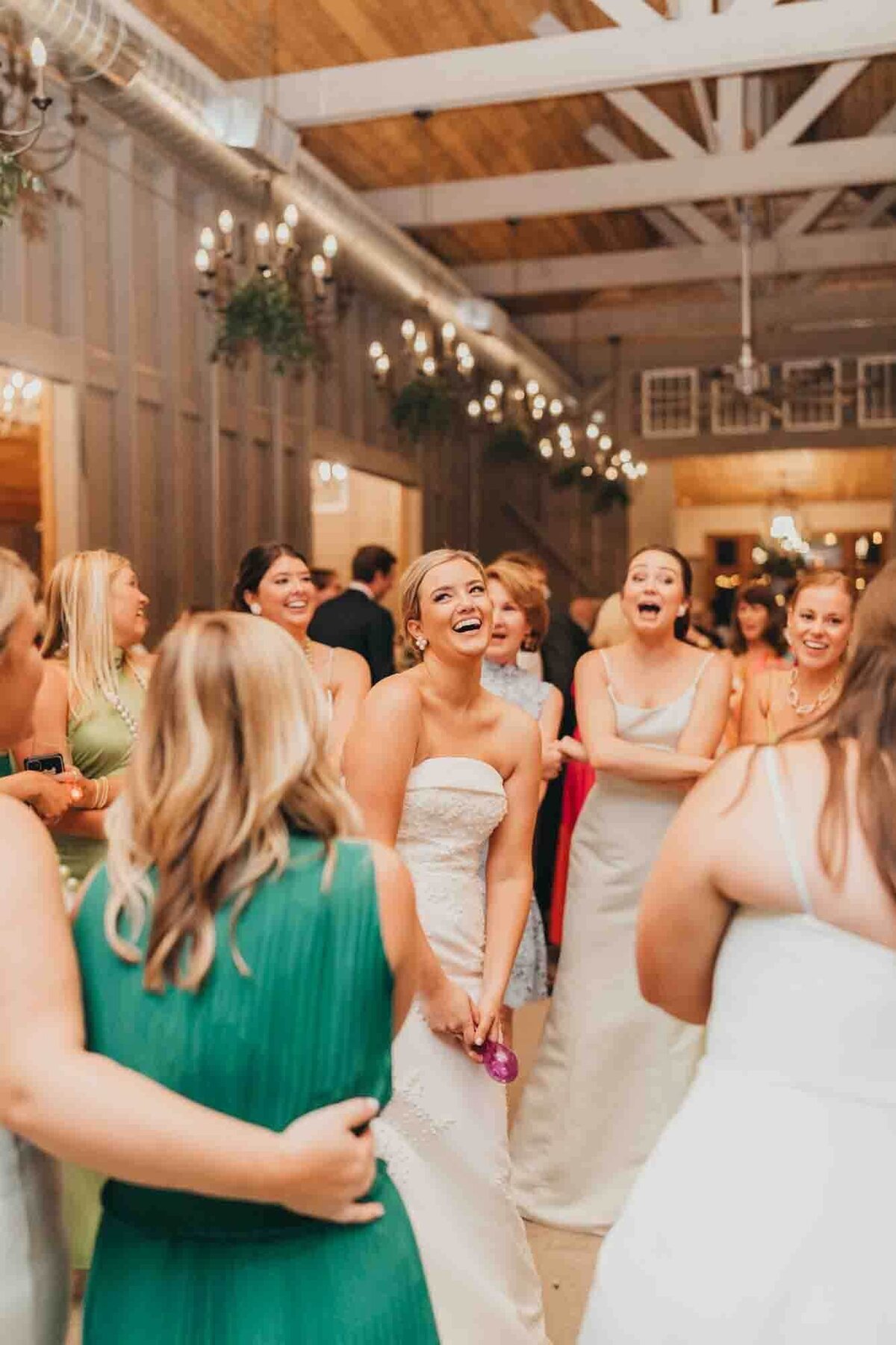 bride stands in the middle of a circle while her sorority sisters sing their chant.